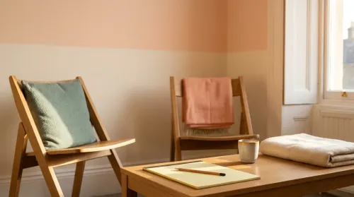 Quiet autism therapy consulting room with two wooden chairs in warm afternoon window light